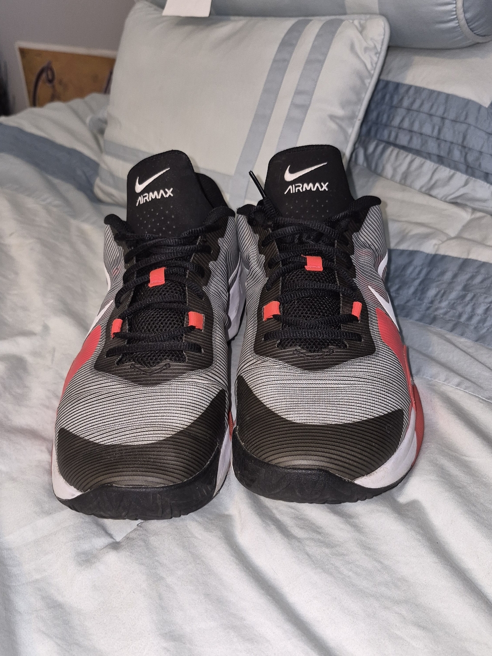 Nike Air Max Impact 4 'Black Bright Crimson' featuring a striped grey and bl